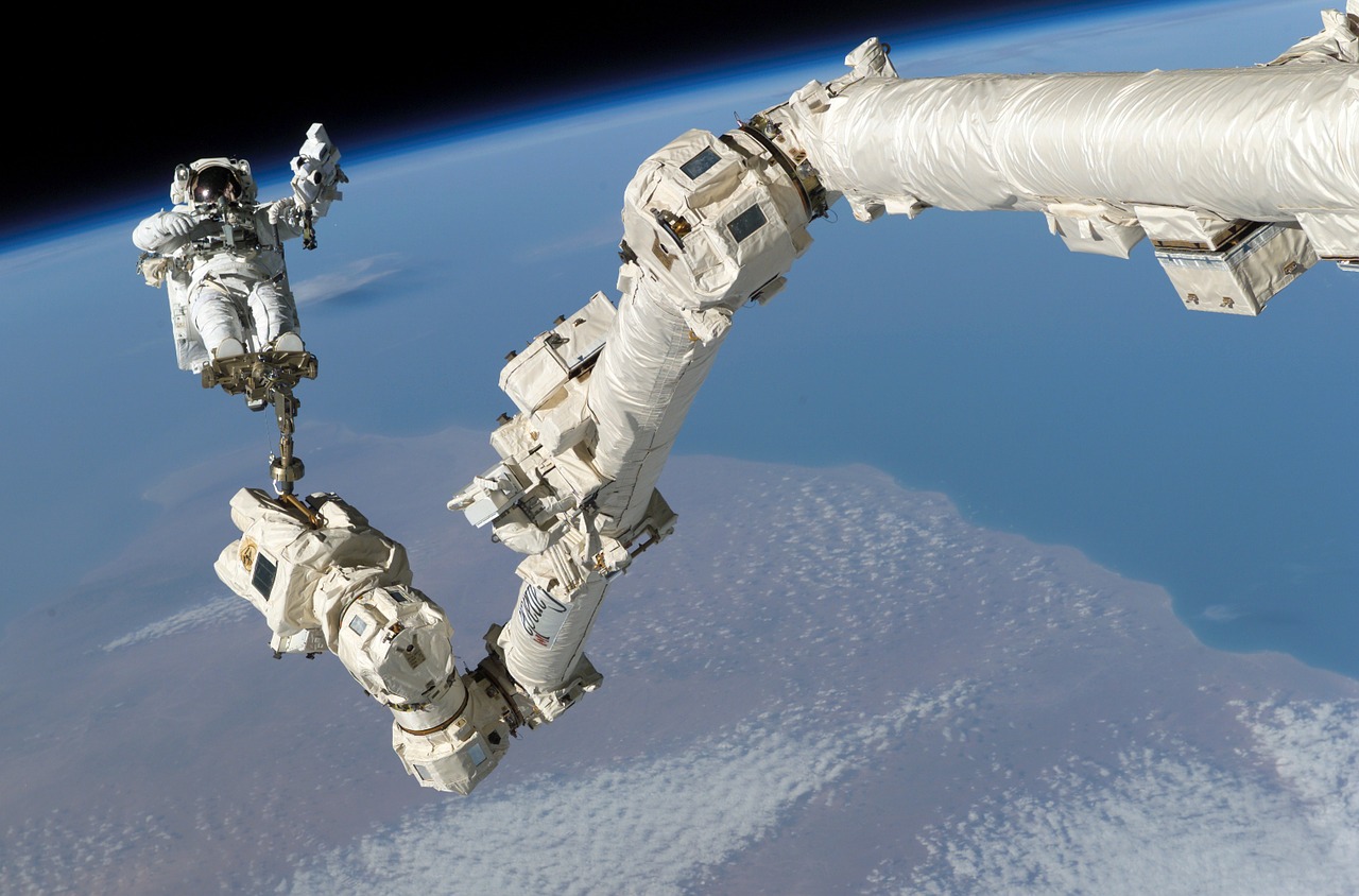 Astronaut on a robotic arm